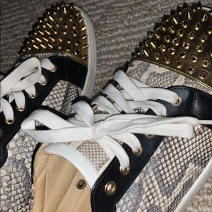 Christian louboutin with snake skin and gold studs